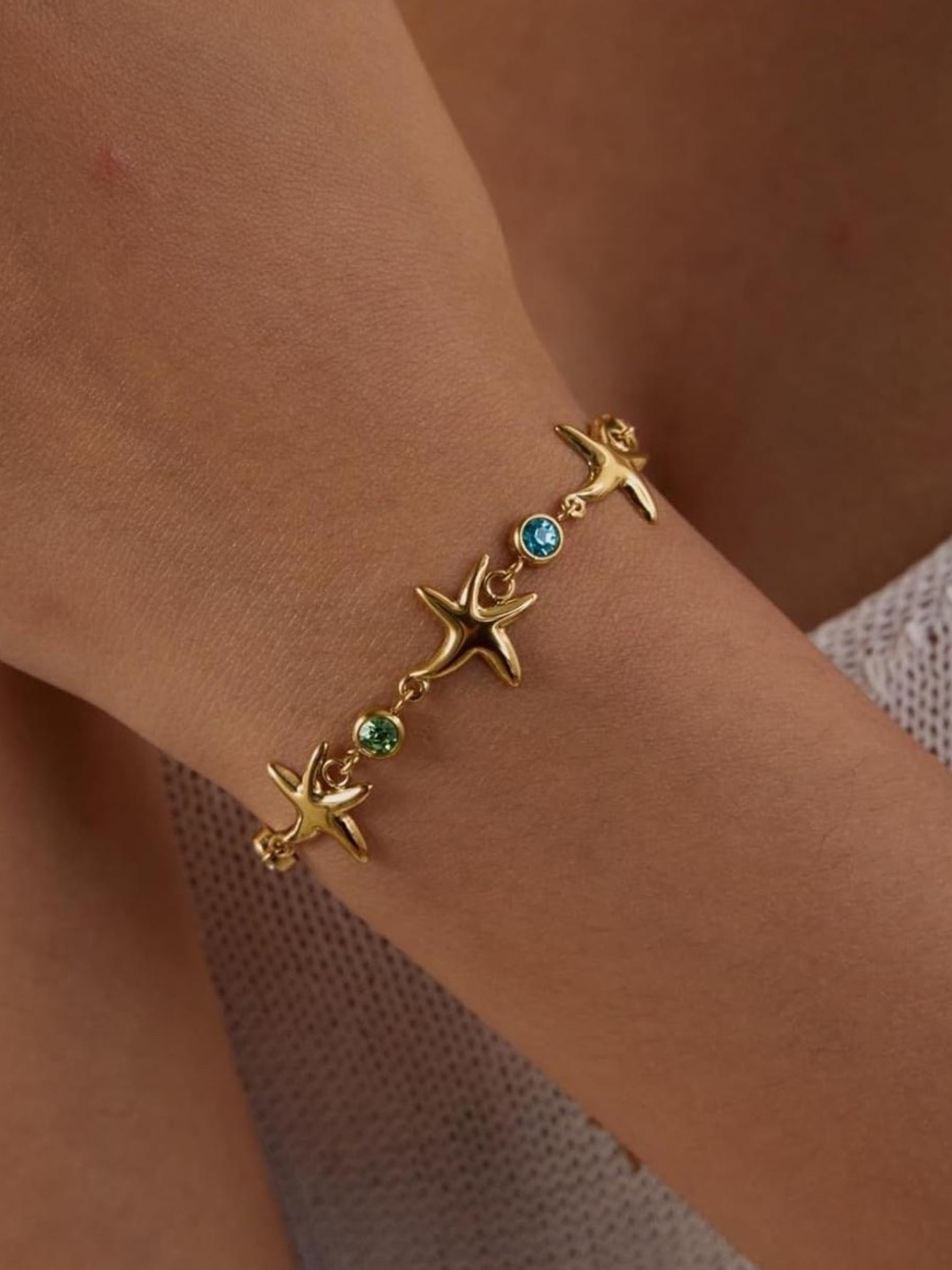Anthropologie Gold Starfish Bracelet with Blue and Green Gems